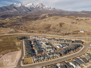 View of property location featuring nearby suburban area and a mountain backdrop