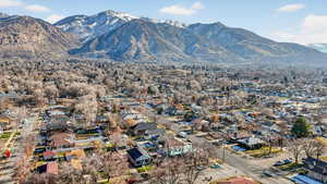 Aerial view of residential area featuring a mountainous background