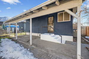 View of side of home featuring a mountain view