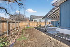 Fenced backyard featuring a patio area