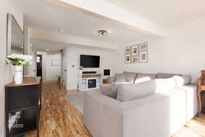 Living area featuring light wood-style floors
