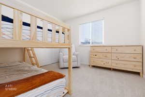 Carpeted bedroom featuring baseboards