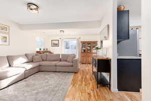 Living room featuring light wood-style flooring