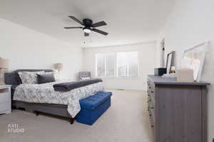 Bedroom featuring light carpet and ceiling fan