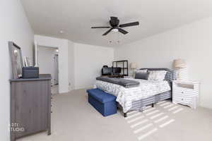 Bedroom with light carpet and ceiling fan