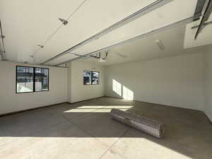 Garage featuring baseboards