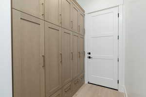 Mudroom featuring light wood-type flooring