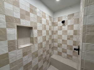 Full bathroom featuring tiled shower