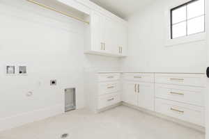 Laundry room featuring hookup for a washing machine, hookup for an electric dryer, hookup for a gas dryer, and cabinet space