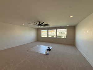 Empty room featuring carpet flooring, recessed lighting, and ceiling fan