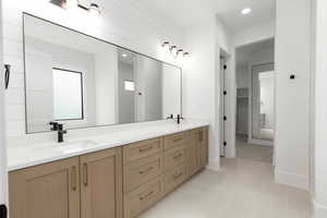 Bathroom with double vanity, recessed lighting, and light tile patterned flooring