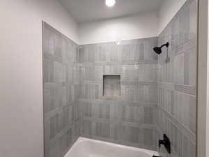 Bathroom featuring bathing tub / shower combination