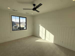 Carpeted spare room with recessed lighting and ceiling fan