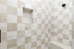 Bathroom featuring a tile shower