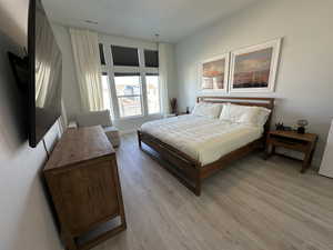 Bedroom with light wood-style flooring
