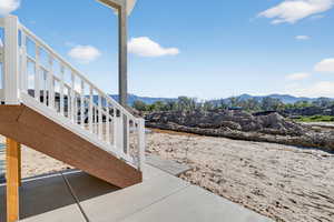 View of patio / terrace with stairway and a mountain view