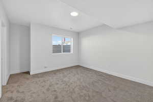Unfurnished room with carpet floors and baseboards