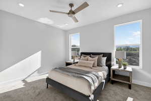 Bedroom featuring carpet flooring, ceiling fan, and recessed lighting