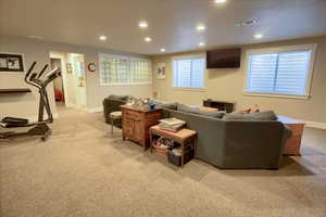 Living room featuring light carpet and recessed lighting