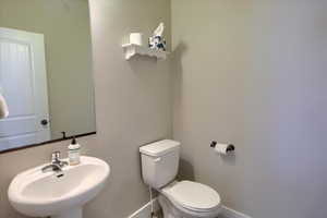 Bathroom featuring toilet and a sink