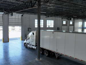 Garage featuring a heating unit