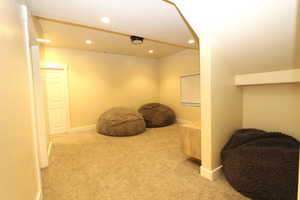 Sitting room featuring light carpet and recessed lighting