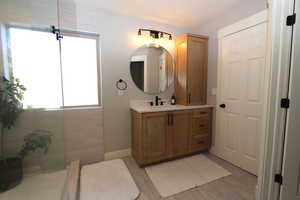 Full bathroom with vanity and walk in shower