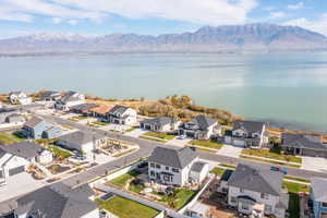Aerial perspective of suburban area featuring a water and mountain view