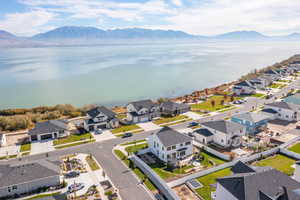 Aerial perspective of suburban area featuring a water and mountain view