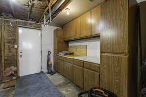 Miscellaneous room with unfinished concrete flooring