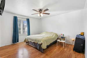 Bedroom featuring light wood finished floors and a ceiling fan