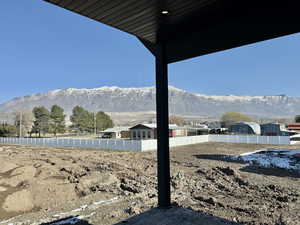 View of yard with a mountain view and a patio area