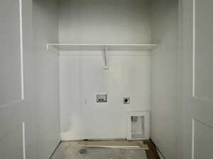 Laundry area featuring washer hookup, hookup for an electric dryer, and concrete floors