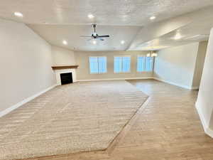 Spacious great room with a gas fireplace and plenty of natural light