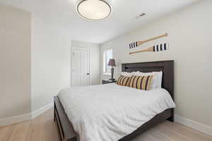 Bedroom featuring baseboards and light wood-style flooring