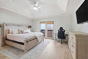 Bedroom featuring wooden ceiling, a ceiling fan, light wood-style floors, access to outside, and a desk