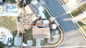 Aerial overview of property's location featuring a pool area and property parcel outlined