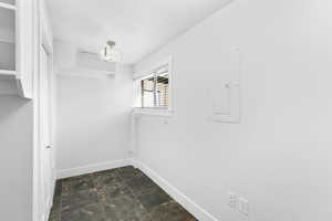 Office with walk in closet with hook ups for high speed servers and Cad 6 ethernet.