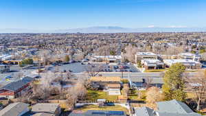 Aerial overview of property's location facing west featuring mountains and nearby Edgemont Community