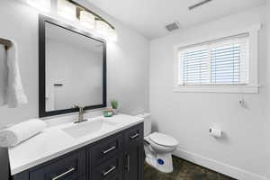 Bathroom with vanity and toilet