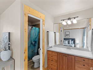 Bathroom with a shower with curtain, vanity, ensuite bath, and light tile patterned floors