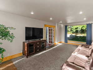 Living area featuring recessed lighting and baseboards