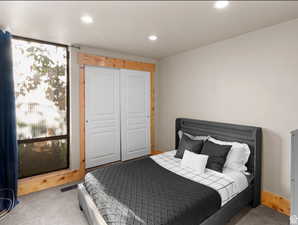 Bedroom featuring a closet, carpet flooring, and recessed lighting