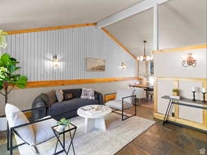 Living area featuring stone finish flooring and a chandelier