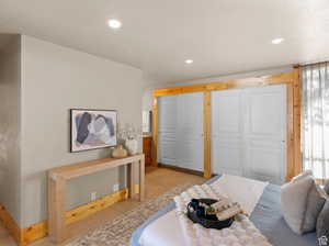 Tiled bedroom with recessed lighting