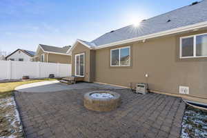 Back patio with a gas fire pit