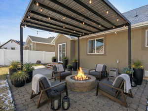 virtually staged back patio, pergola is not installed. Firepit is gas operated and built in.