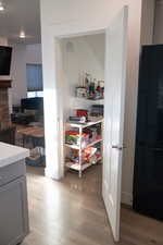 Under-stairs view of pantry or coffee nook