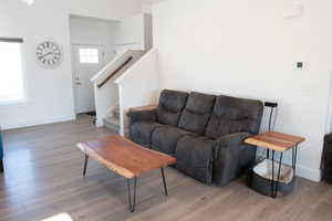 Living room with stairs and wood laminate floors