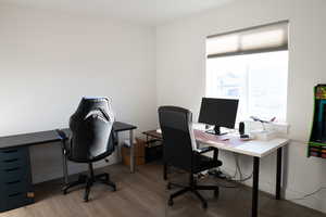 Bedroom 3 used as office space featuring light wood-style flooring